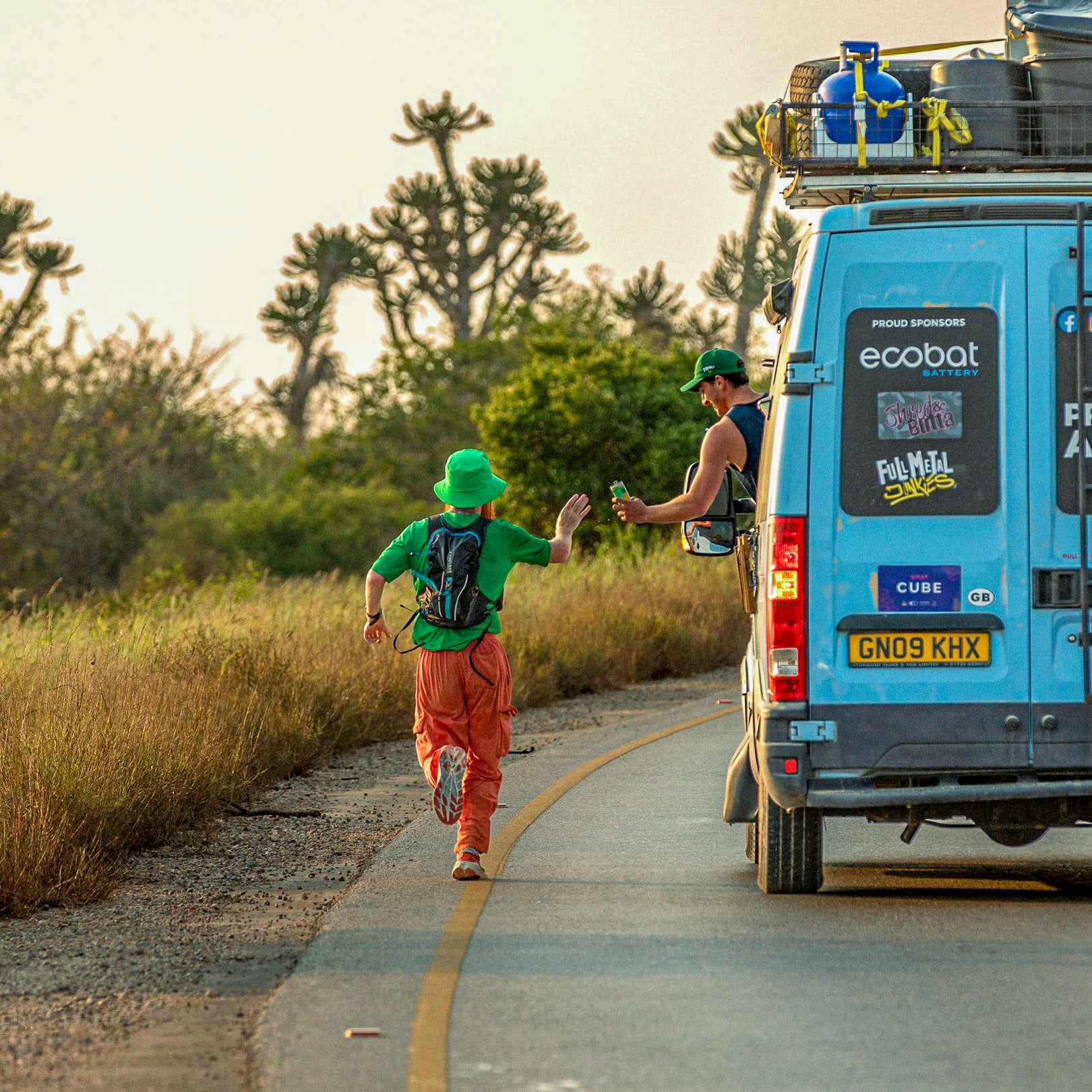 Russ Cook Running alongside his van in Angola