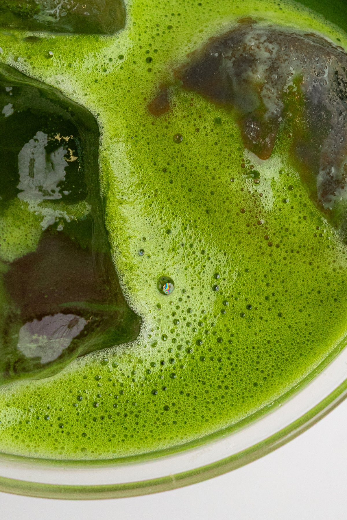 a green liquid in a glass