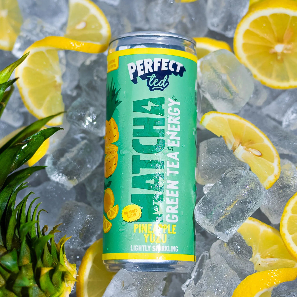 Pineapple Yuzu healthy energy drink on ice with sliced citrus fruit